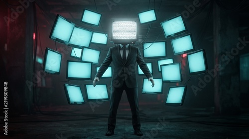 A man in a dark suit with a vintage TV for a head is positioned amidst a chaotic explosion of colorful, flickering television screens.