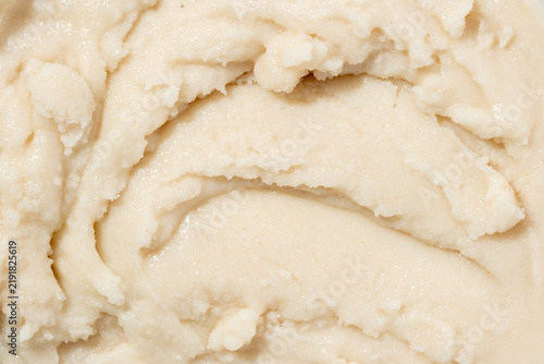 Shea body butter texture close up cosmetic cream background.