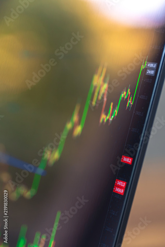 Close view of rising trading chart on screen. Financial market data and investment content.