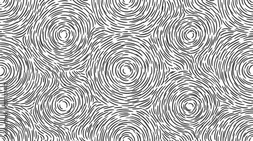 Abstract grey background with black concentric circular patterns for modern design.