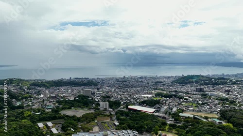Aerial drone footage over coastal city of Beppu, Oita, Japan