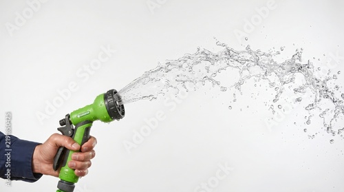 Green Garden Hose Sprays Water in Dynamic Stream