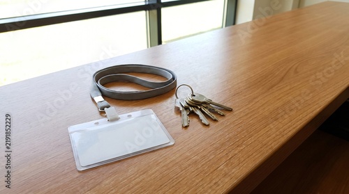 Offboarding: Blank Identity Pass And A Set Of Keys Left On An Empty Office Desk