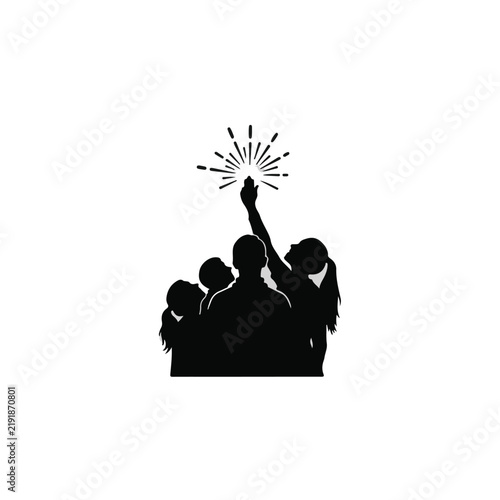Family silhouette reaching for a bright spark of inspiration