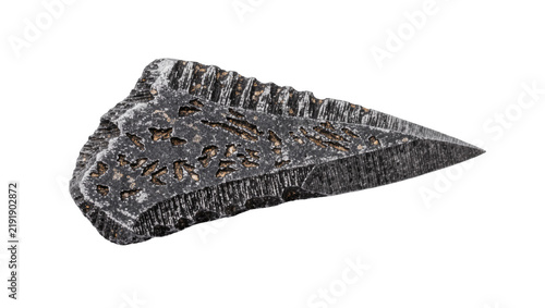 Foto Rough dark grey stone arrowhead with carved ancient symbols, isolated on transpa