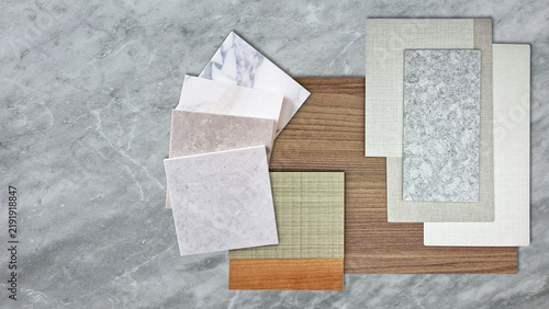 Interior design material sample moodboard with marble tiles wood swatches fabric textured wallpaper and stone color palette for architectural interior decorator presentation mockup backdrop.