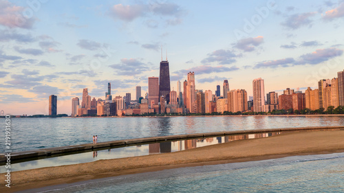 Chicago skyline reflected along Lake Michigan shoreline
