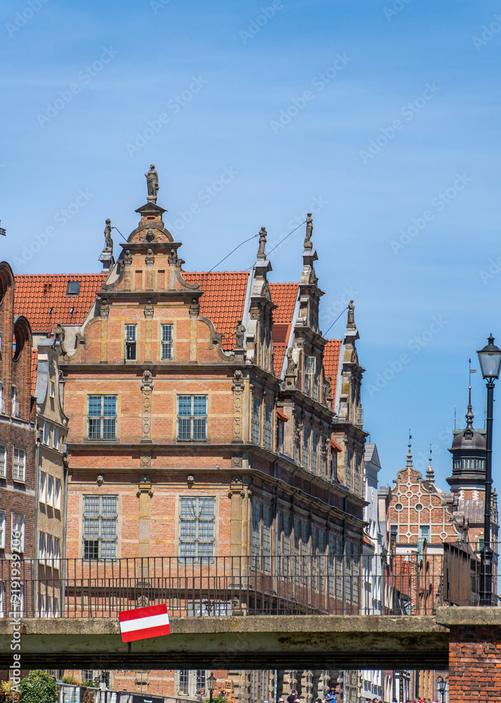 Obraz premium GDANSK, POLAND - JULY, 2026: Green Gate facades framed by bridge structure