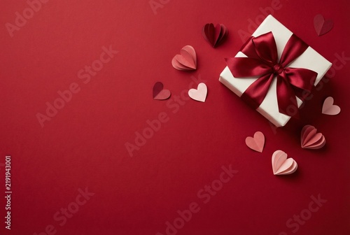 Valentines Day Gift Box On Red Background With Hearts