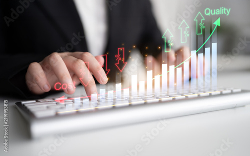 Bild auf Leinwand Business Professional Analyzing Data Trends and Metrics with Keyboard in Modern Office Setting for Cost and Quality Improvement