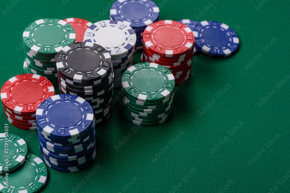 Obraz premium Multi colored gaming chips for betting in casino games. Betting chips