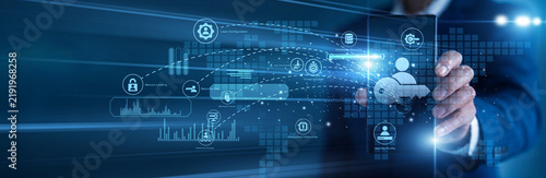 Security specialist working on mobile Access Management protocols. Administrator using a tablet analyzing user authentication logs and secure authorization graphs on a glowing 3D screen.