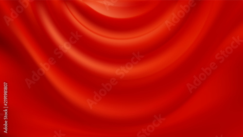 Red silk background. Draped satin fabric. Smooth flowing folds.
