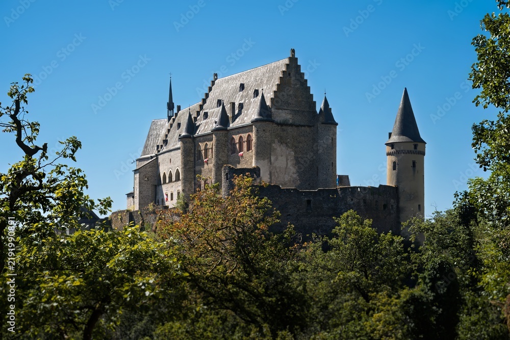 Fototapeta premium Famous Vianden Castle Medieval Fortress Perched on Forest Hilltop Luxembourg