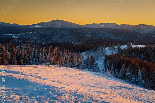 Winter sunset with a view of the Montenegrin ridge of the Ukrainian Carpathians