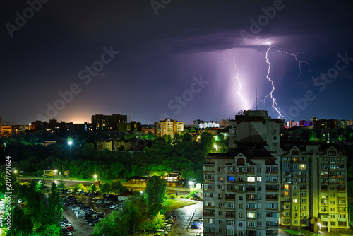 Lightning and a stormy sky over the city at night