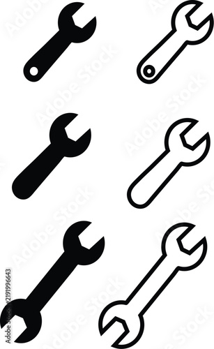Black and white wrench tool icons seamless pattern on transparent background