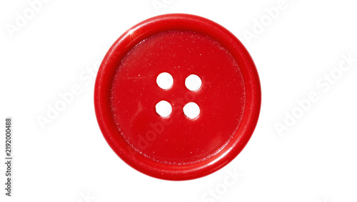Fotografie Shiny red plastic button with four holes, isolated on transparent background