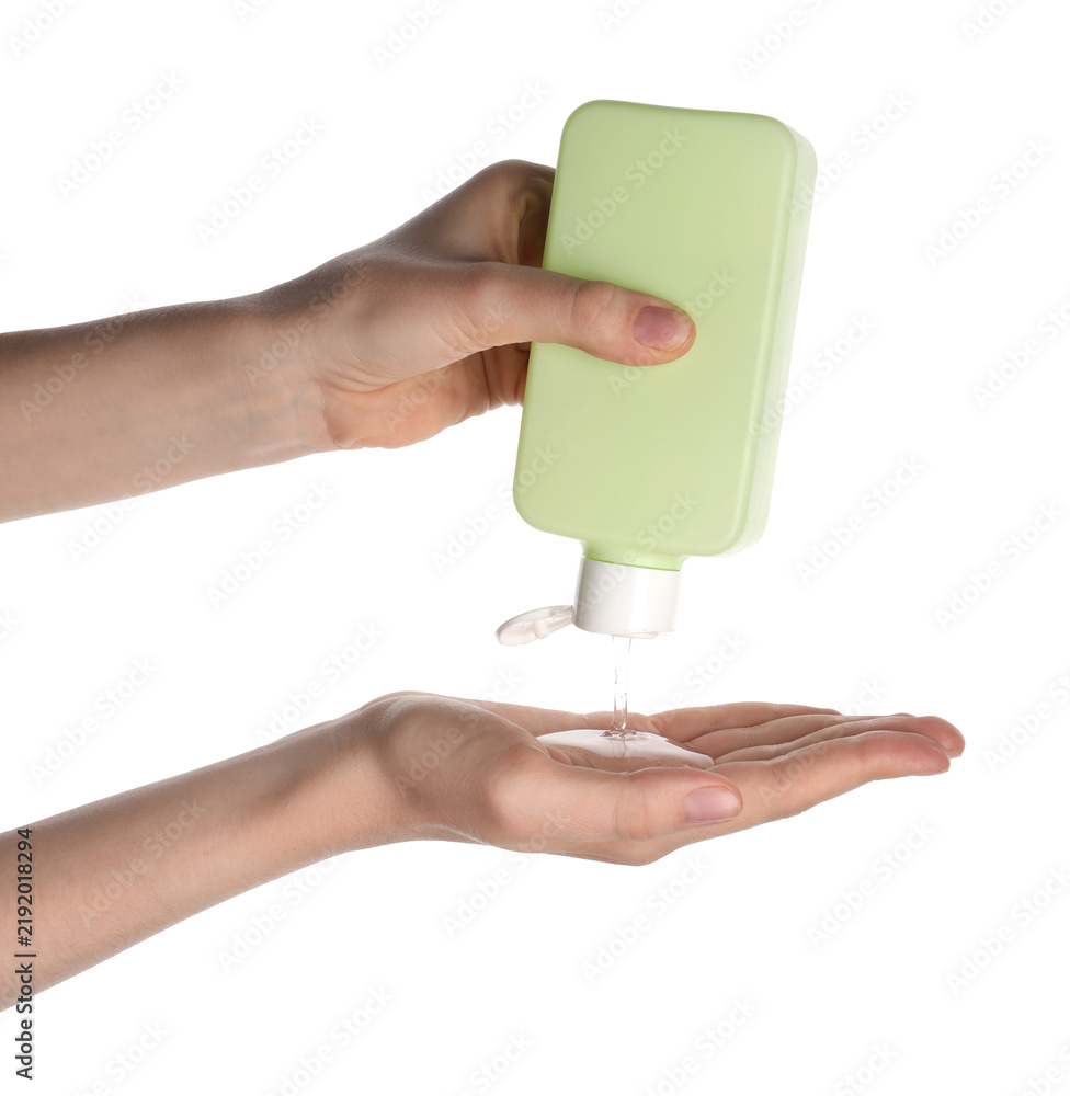 Obraz premium Woman squeezing shampoo from bottle into hand on white background, closeup