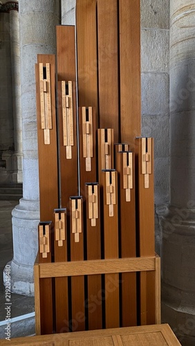 Fotografie Geometric close up of wooden pipe organ pipes arranged in diagonal sequence