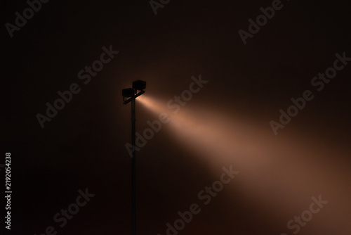 A beam of light from the floodlight
