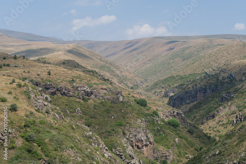 Canvas Print Landscape view of Amberd Fortress surrounded by rugged mountains and valleys, fe