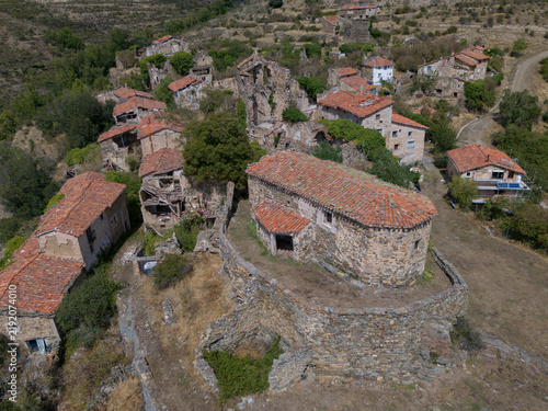 Fotografie Aerial view of abandoned stone village and ancient church ruins