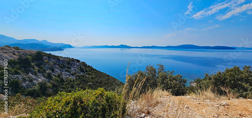 Wonderful photos of a stunning landscape in Croatia, featuring sweeping views, arid terrain, and endless expanses with water and buildings