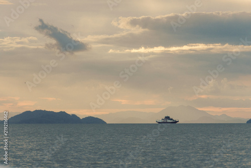 Quadro su tela Ferry Crossing Tropical Ocean at Sunset