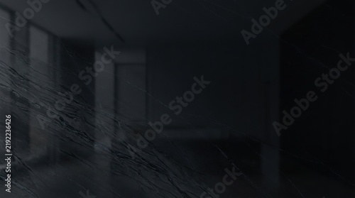 Dark moody black marble surface with subtle grey veining and soft reflective lighting for sophisticated high-end architectural backgrounds