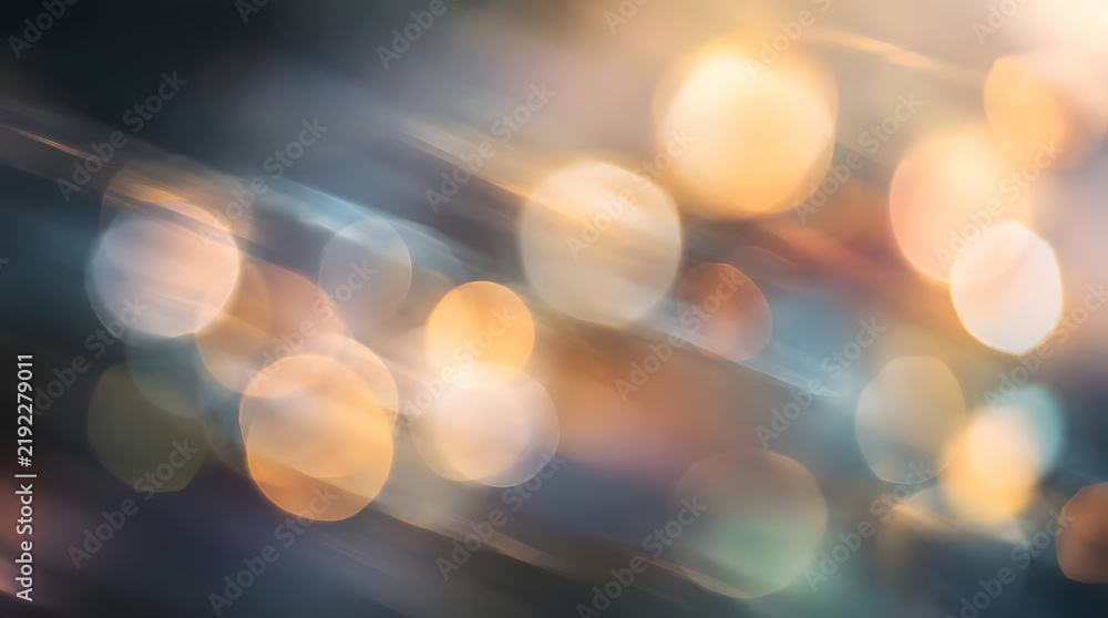 Fototapeta premium Abstract golden bokeh light background with soft motion blur