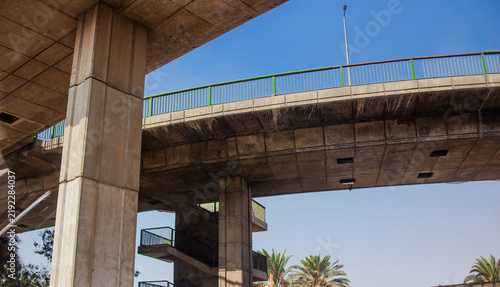 Modern concrete overpass bridge structure against blue sky in urban city environment Cairo, Egypt