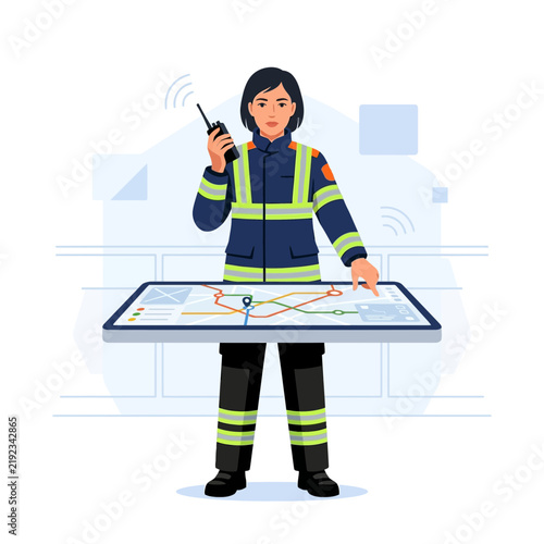 Female firefighter using radio and digital map on tablet for emergency response