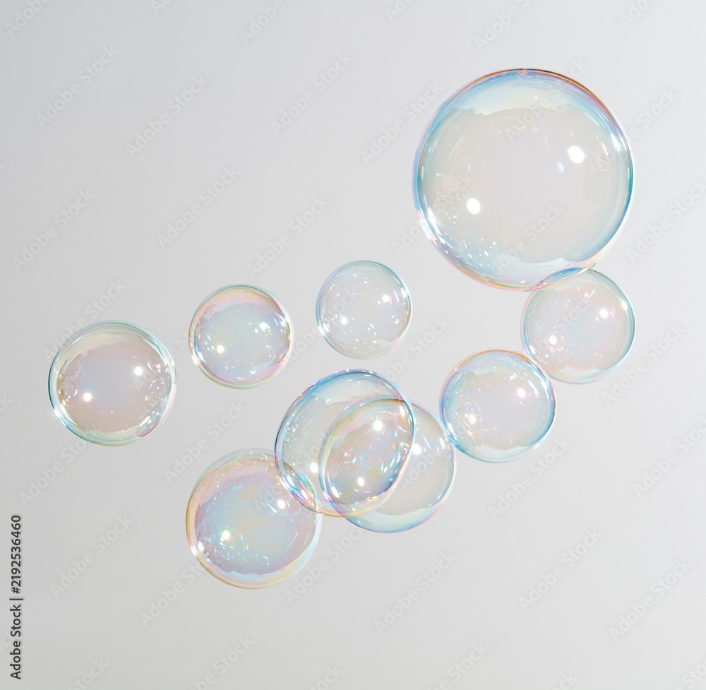 Obraz premium Colorful soap bubbles floating on white background