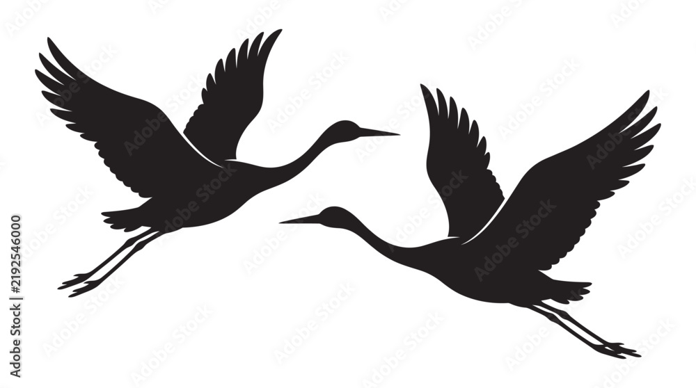 Obraz premium Two cranes in flight are depicted as a black silhouette