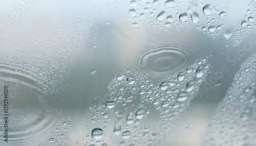 Raindrops Glass with Blurred Overcast Background