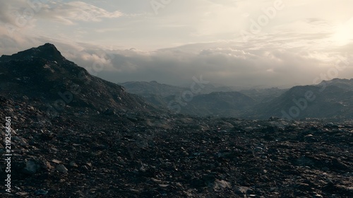 Dramatic landscape of a vast rocky desert under a cloudy sunset sky. Represents environmental change or harsh wilderness themes.