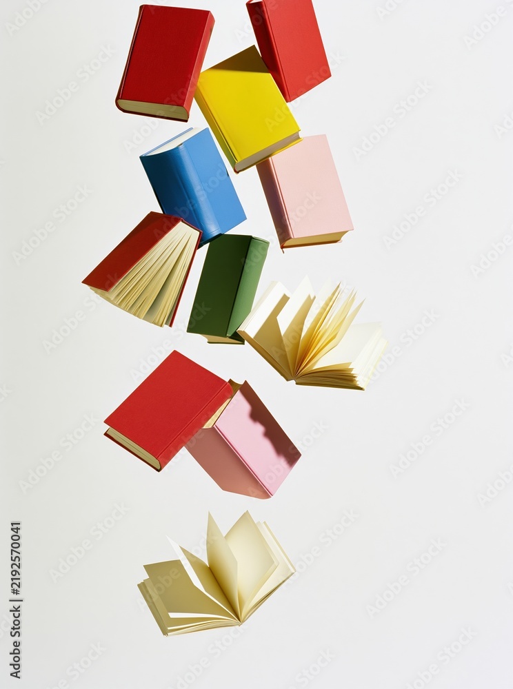 Obraz premium Colorful books floating in white space