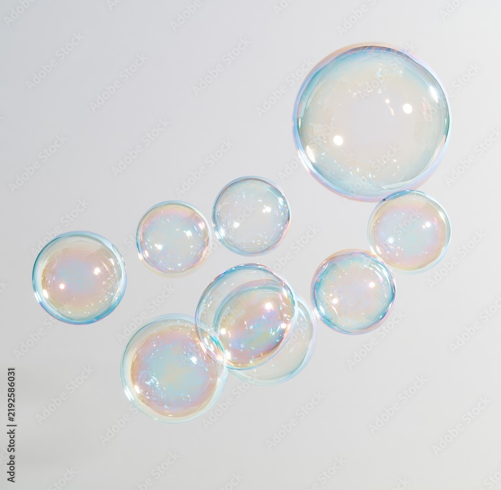 Obraz premium Colorful iridescent soap bubbles floating against a plain