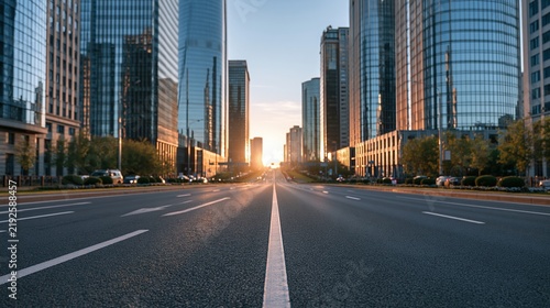 Modern city avenue with skyscrapers at sunrise