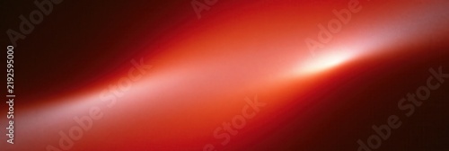 Abstract red gradient with soft light sweep and dark corners