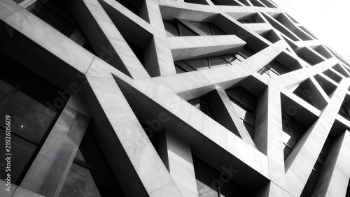Black and white view of modern building facade with triangular pattern