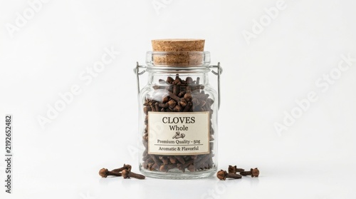 Glass jar filled with dried cloves and cork stopper dried spices kitchen storage spice jar food photography food ingredients spice collection glass container transparent jar still life