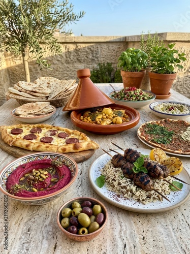 Middle Eastern food spread with tagine and flatbread