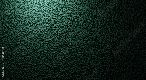 Dark green textured surface background with subtle rough pattern and deep gradient lighting, ideal for luxury design, nature themes, industrial concepts, wallpapers, presentations, and creative