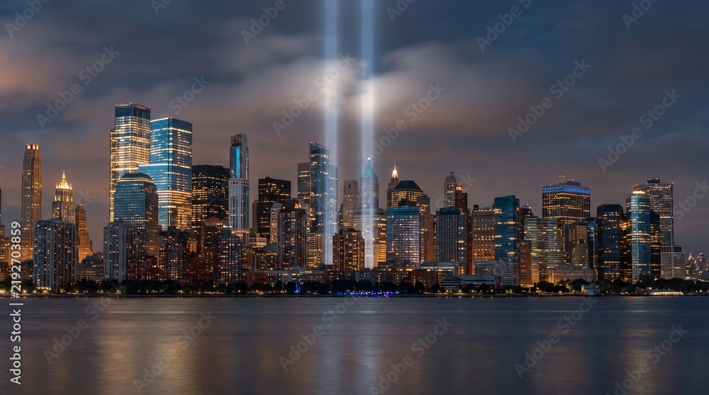 Fototapeta premium Fictional American City Skyline at Twilight with Twin Blue Memorial Light Beams