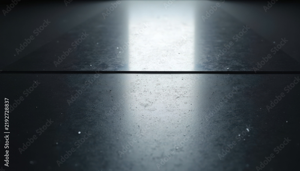 Fototapeta premium Abstract surface with reflective black texture and light streaks illuminating layout. Smooth black surface features subtle dust details, creating an elegant appearance in minimalistic visual design.