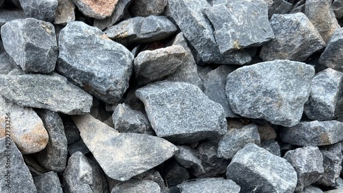 Pile of grey gravel macadam background for construction