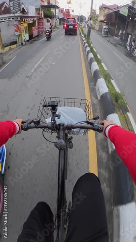 POV Cycling Through Busy Urban Traffic