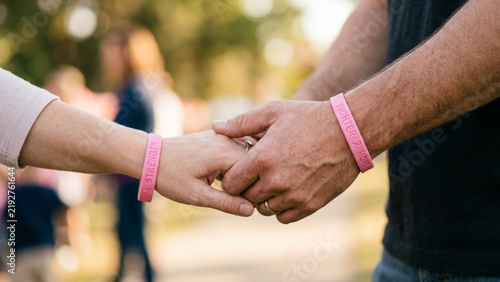 Pink ribbon symbol representing breast cancer awareness and support for patients.